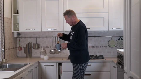 Mature man has breakfast Stock-Footage 165665067