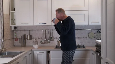Mature man has breakfast 動画素材 165669324