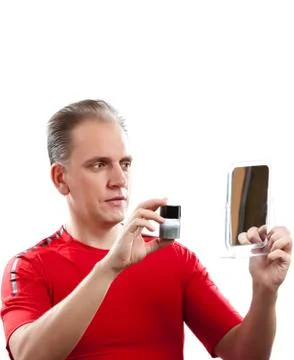 The mature man has reflected on application of a man's cream against wrinkles Stock Photos