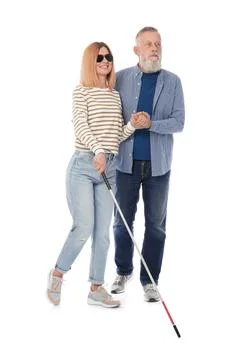 Mature blind person with long cane walking on white background