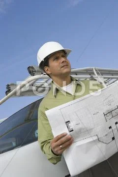 Mature Man Holding Blueprint Stock Photos