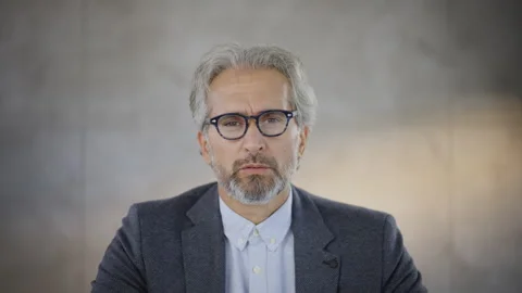 Mature man looking at camera and intently listening. Serious face expression of Stock Footage 164461017