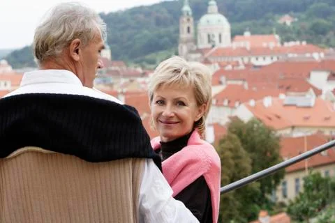Mature man looking at view while mature woman looks at camera Stock Photos