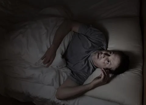 Mature man not able to fall asleep during night time Stock-Fotos