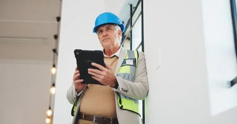 Mature, man or architect thinking with tablet in building for construction Stock Photos