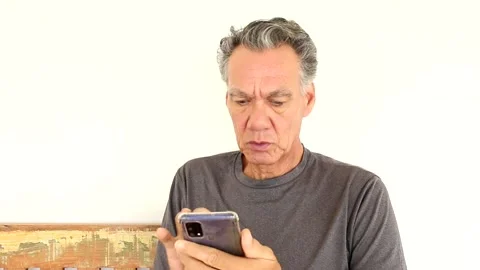 Mature man outside using his smartphone Stock Footage 168903594