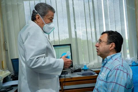Mature man performing pulmonary function test and spirometry Stock Photos