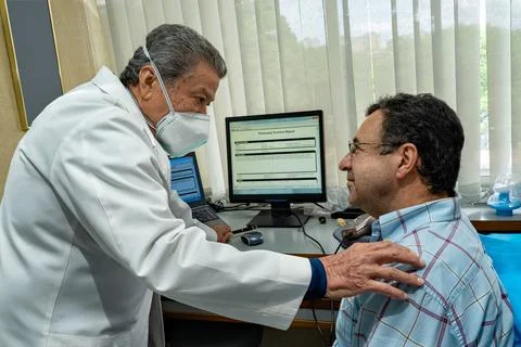 Mature man performing pulmonary function test and spirometry Stock Photos
