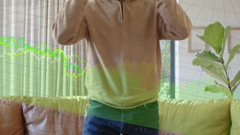 Mature man picking white VR headset putting on standing gesturing waveforms Stock Footage 333859678