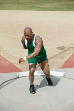 Mature Man Preparing To Throw Discus Stock Photos