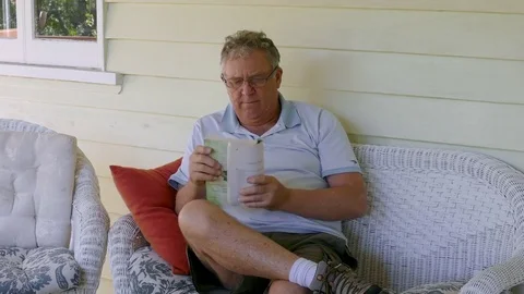 Mature Man Reading A Book Stock Footage 77526370