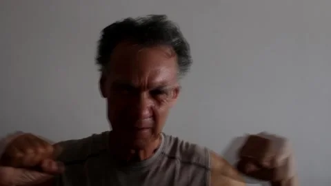 Mature Man shadow boxing by himself Vídeo Stock 197172610