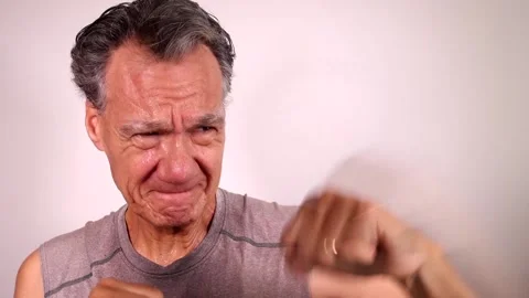 Mature Man shadow boxing by himself Stock Footage 219635352