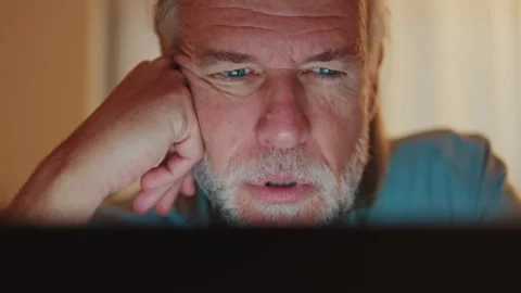 Mature Man Shows Surprise While Using Digital Device at Home Stock Footage 338340123