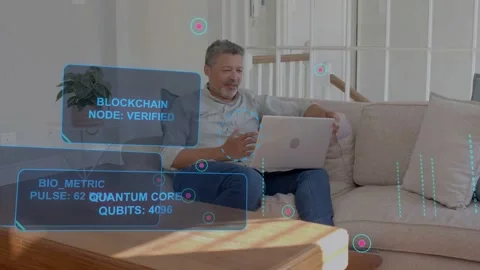 Mature man on sofa typing on laptop, causing blockchain HUD growing, verifying Stock Footage 333789923