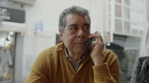 Mature man speaking on smartphone Stock Footage 225362676