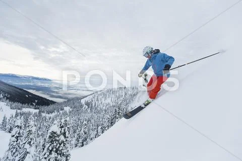 Mature Man Speeding On Ski Slope