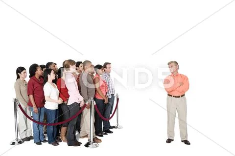 A mature man standing out from the crowd Stock Photos