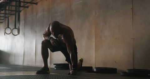 Mature man taking break after exercise in gym Stock Footage 116400869