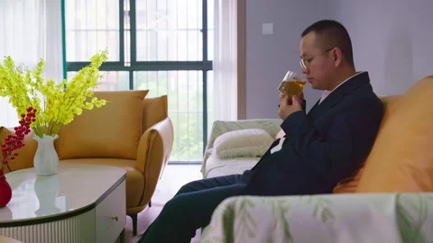 A mature man tasting a cup of tea at home Stock Footage 320093085