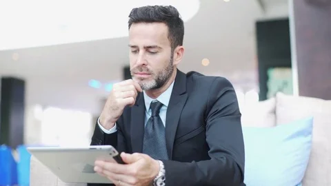 Mature man using digital tablet Stock Footage 75171634