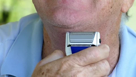 Mature Man Using Electric Shaver Stock-Footage 77286644