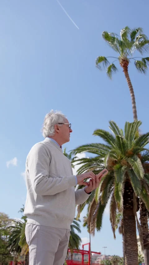 Mature man using gps navigation on phone Stock Footage 269917746