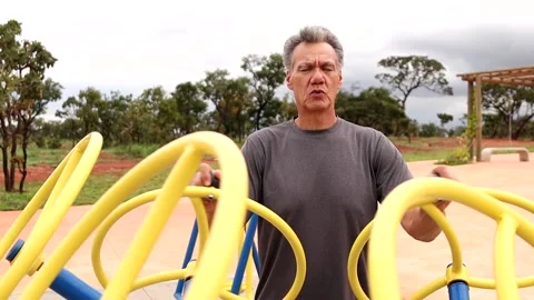 Mature Man Using a Tai Chi Spinner Stock Footage 233998173