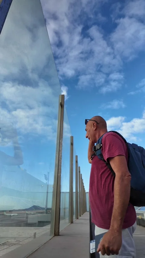 Mature man waiting for his flight at Gran Canaria airport Stock Footage 345362289