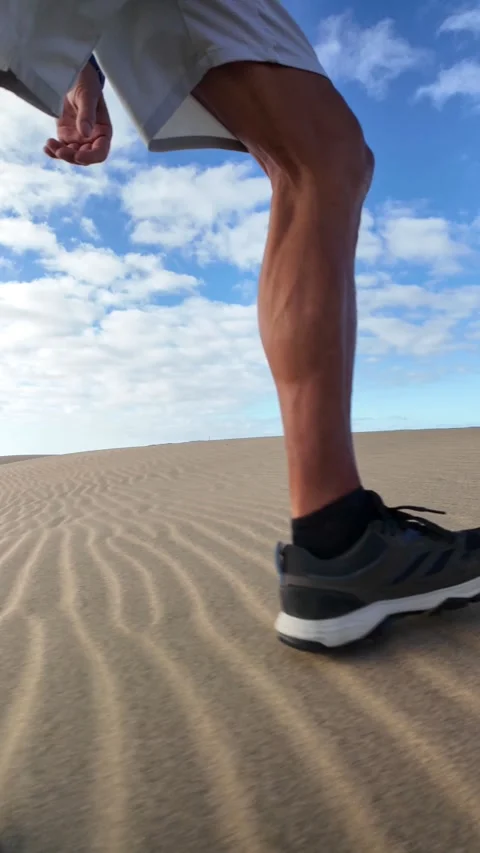 Mature man walking with effort on sand dunes Stock Footage 346177652
