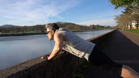 Mature man warming up before jogging Stock Footage 72092455