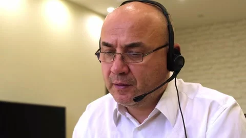 Mature man wearing headset microphone talking customer support Stock Footage 322736699