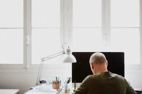 Mature man working in creative studio Stock Photos