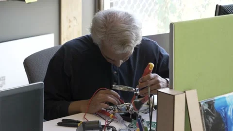 Mature man working in electronics workshop Stock Footage 220467859
