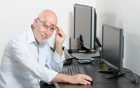 Mature man working with his computer Stock Photos