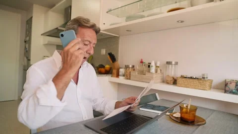 Mature man working remotely from home office Stock Footage 343218546