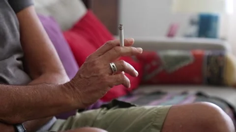 Mature man's hand with cigarette Video stock 65248085