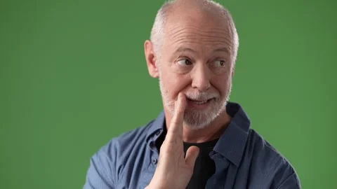 Mature Middle-Aged Man Posing in Front of a Green Screen Backdrop Stock Footage 311116592