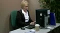 Mature office worker messing about at work HD Footage