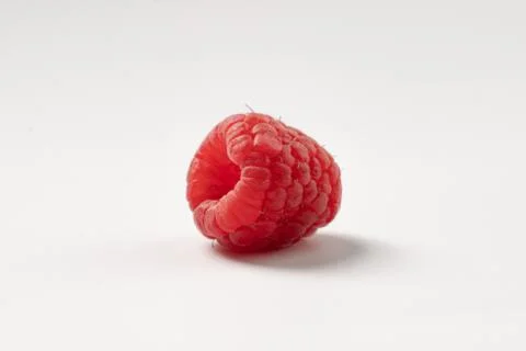 Mature raspberry on a white background Stock Photos