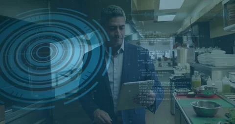 Mature restaurant manager tapping tablet and checking order data, HUD overlay Stock Footage 334040721