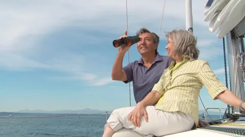 Mature Sailing Couple Using Binoculars Stock Footage 32015537
