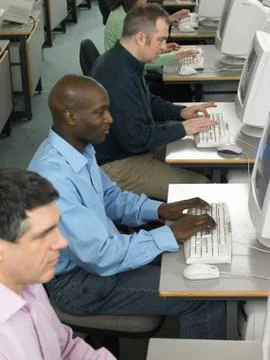 Mature students using computers 写真素材