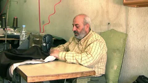 Mature tailor with a sewing machine Stock Footage 10593025