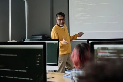 Mature Teacher Speaking About Code Stock Photos