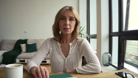 Mature teacher tutor look at web camera, tell information and explain online Stock Footage 149387304
