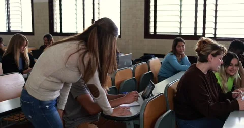 Mature teacher working with students inside classroom at school university Stock Footage 203725862