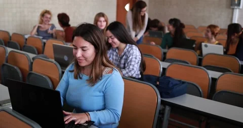 Mature teacher working with students inside classroom at school university Stock Footage 203726606