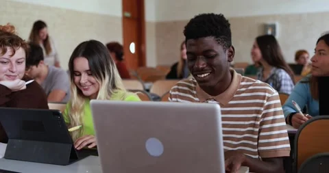 Mature teacher working with students inside classroom at school university Stock Footage 203726662