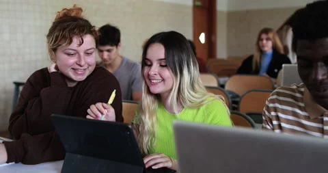 Mature teacher working with students inside classroom at school university Stock Footage 203727260